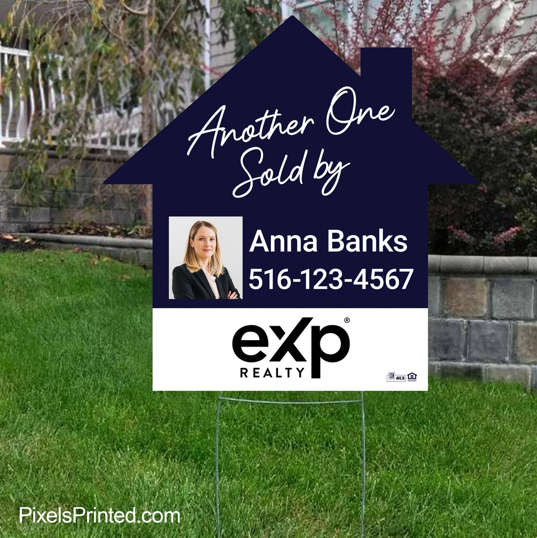 eXp Realty house shaped sold by realtor yard sign that promotes the agent after successfully selling a neighborhood home.