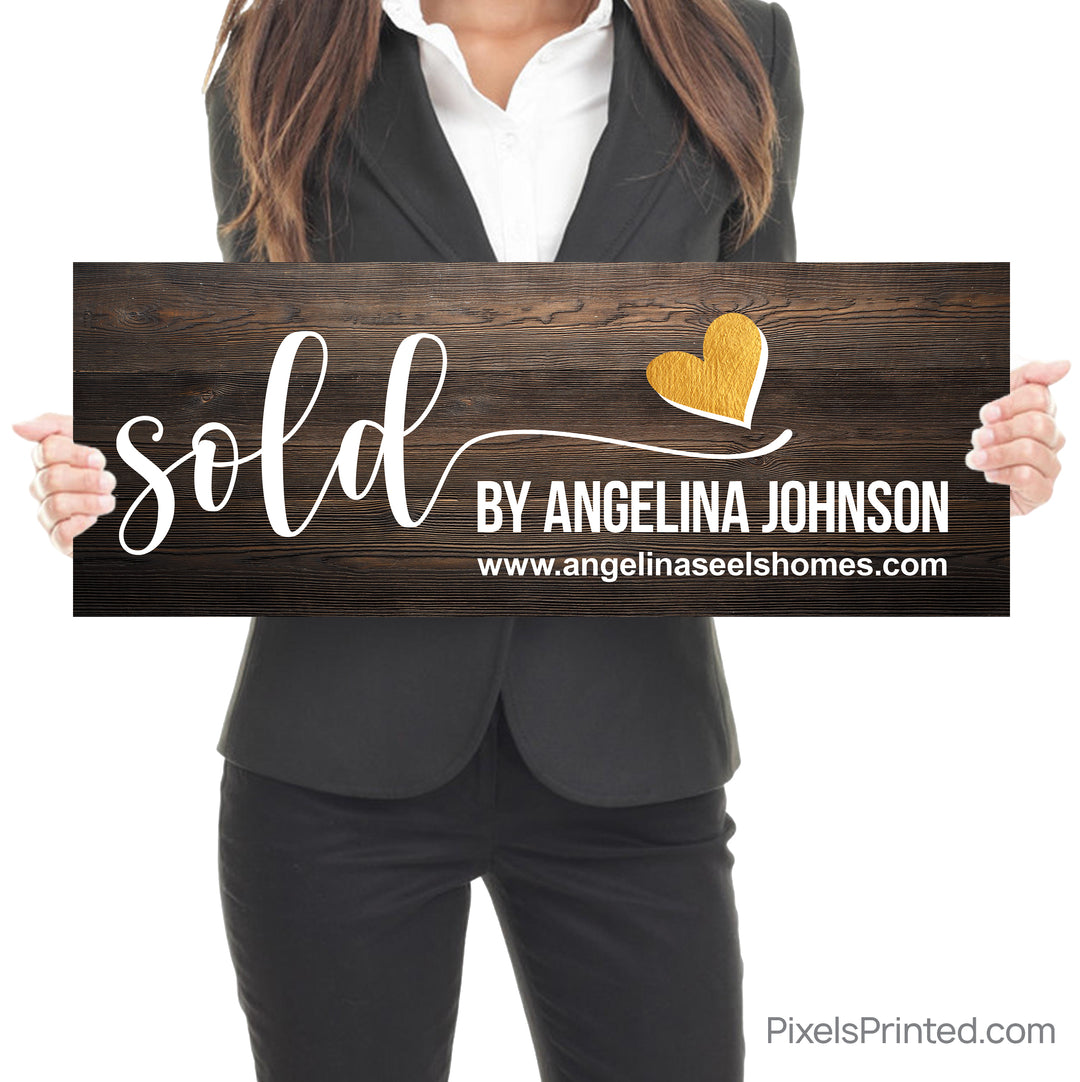 closing photo sign with homeowners sold by realtor with gold heart